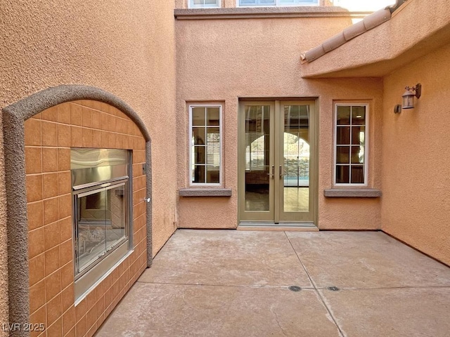 doorway to property featuring a patio and french doors