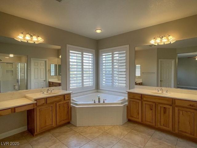 bathroom featuring tile patterned floors, shower with separate bathtub, and vanity