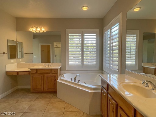 bathroom featuring shower with separate bathtub, tile patterned floors, and vanity