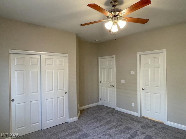 unfurnished bedroom featuring a closet, ceiling fan, and dark colored carpet