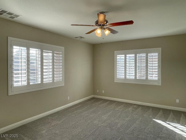 unfurnished room with carpet flooring and ceiling fan