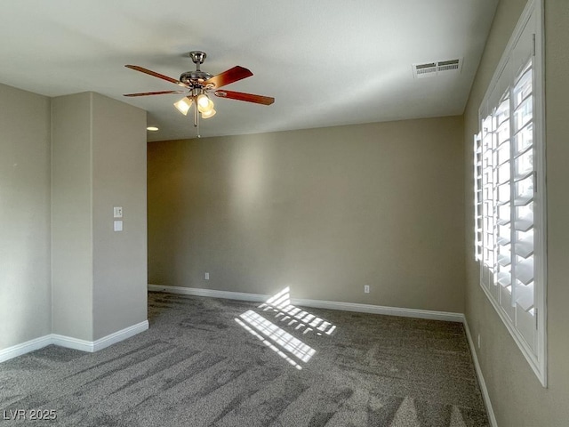 carpeted empty room with ceiling fan