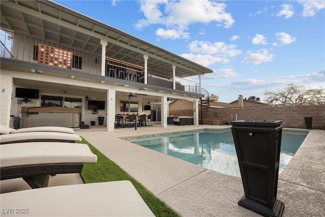 view of pool with a hot tub, a patio, outdoor lounge area, and ceiling fan