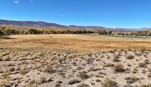 mountain view featuring a rural view