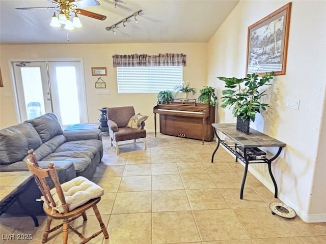 living room featuring light tile patterned floors, track lighting, french doors, and ceiling fan