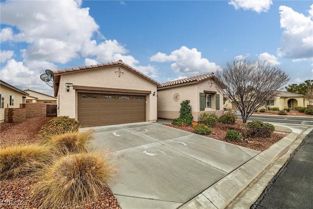 mediterranean / spanish-style home with a garage