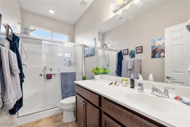 4459 Lavender, Pahrump, NV 89061 - bathroom with vanity, toilet, tile patterned flooring, and a shower with door