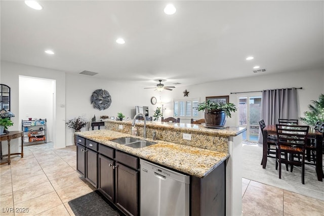 4459 Lavender, Pahrump, NV 89061 - kitchen with sink, stainless steel dishwasher, light stone counters, dark brown cabinetry, and a center island with sink