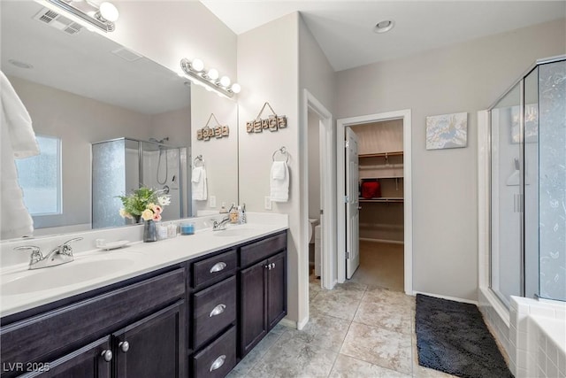 4459 Lavender, Pahrump, NV 89061 - full bathroom featuring vanity, tile patterned flooring, shower with separate bathtub, and toilet
