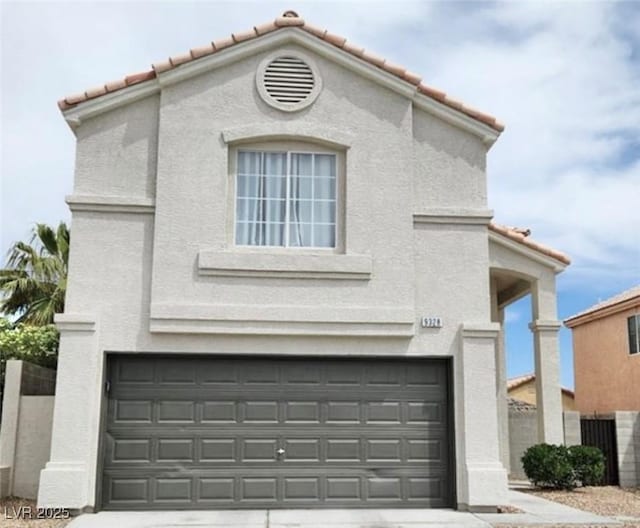 view of front of property with a garage