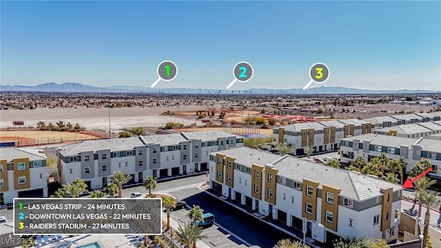 birds eye view of property with a mountain view