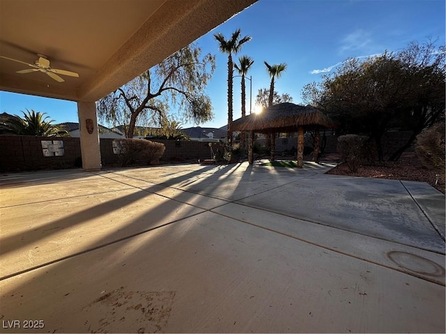 exterior space featuring a gazebo, a patio area, and ceiling fan