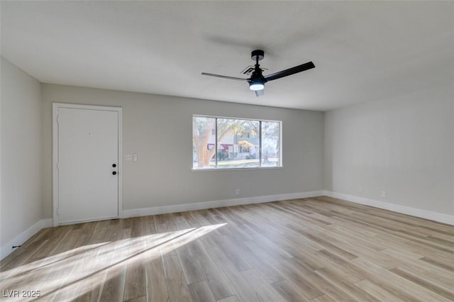 empty room featuring ceiling fan and light hardwood / wood-style floors