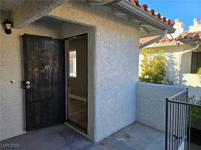 entrance to property with a balcony