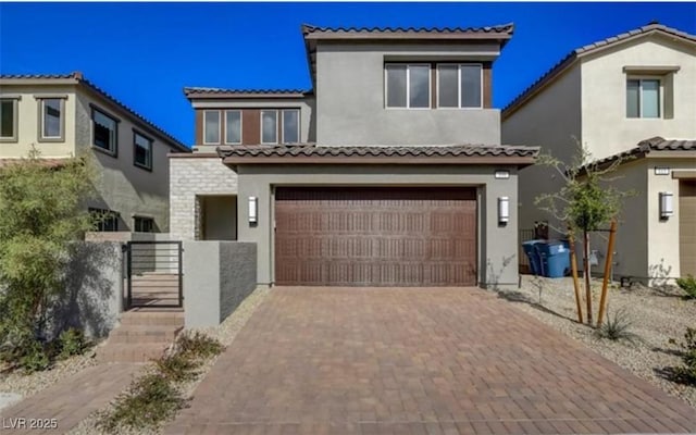 mediterranean / spanish house with a garage