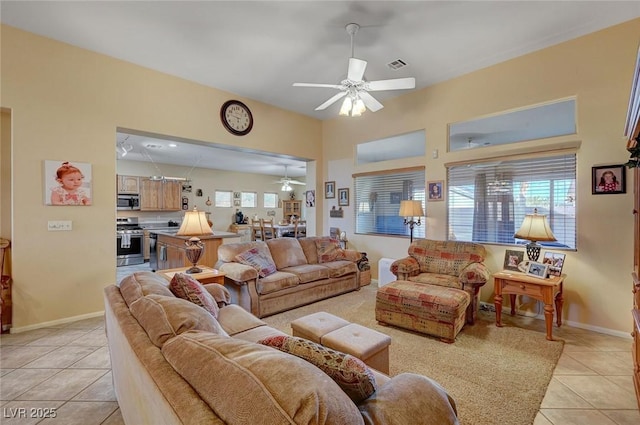 tiled living room featuring ceiling fan