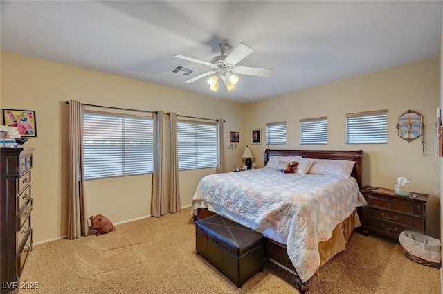 bedroom with light carpet and ceiling fan