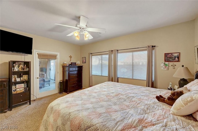 bedroom with ceiling fan, light colored carpet, and access to exterior