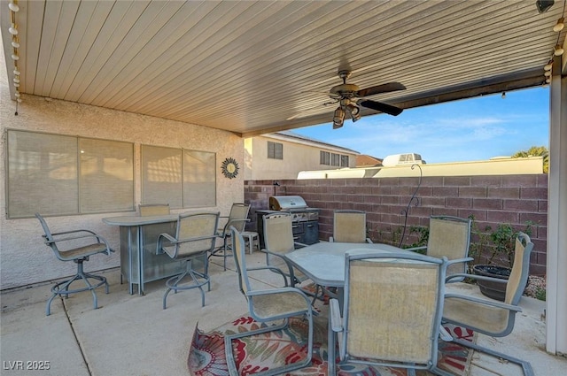 view of patio with grilling area and ceiling fan