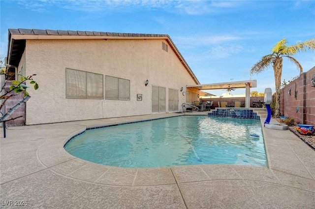 view of pool with a patio and ceiling fan