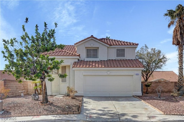 mediterranean / spanish-style home featuring a garage