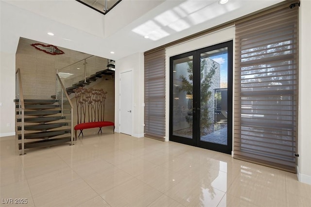 interior space featuring light tile patterned floors and french doors