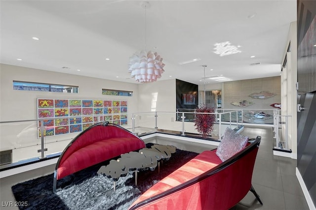 recreation room featuring an inviting chandelier