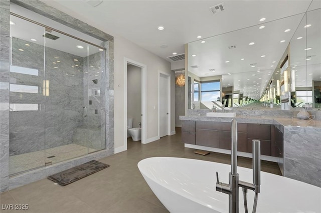 bathroom with vanity, separate shower and tub, and a bidet