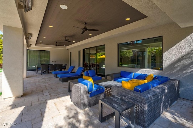 view of patio / terrace with ceiling fan and an outdoor hangout area