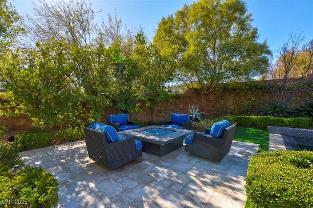 view of patio with a jacuzzi and outdoor lounge area