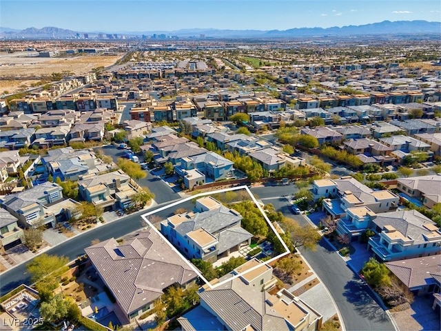 birds eye view of property featuring a mountain view