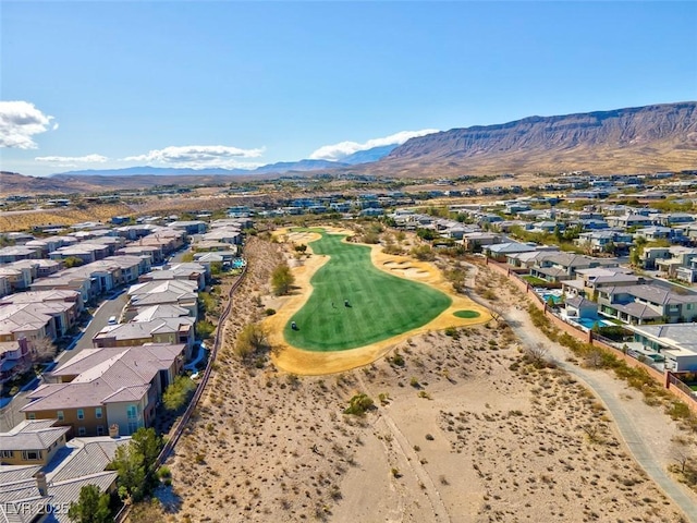 birds eye view of property with a mountain view