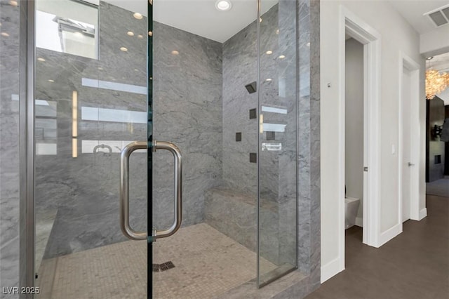 bathroom with a shower with shower door