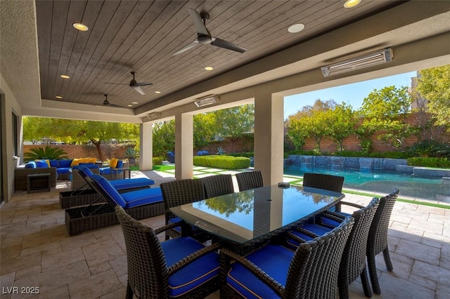 view of patio / terrace with a fenced in pool, an outdoor living space, and ceiling fan