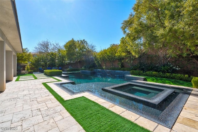 view of swimming pool with a patio and an in ground hot tub