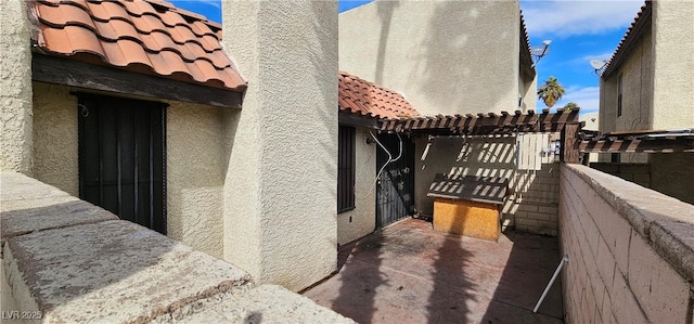 view of home's exterior featuring a pergola