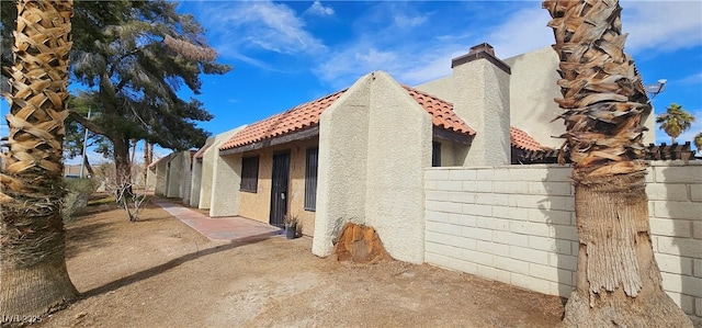 view of home's exterior featuring a patio