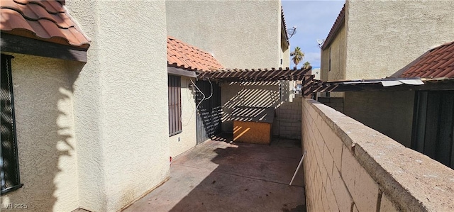 view of side of home featuring a pergola