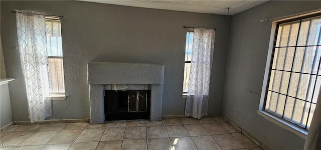 unfurnished living room with light tile patterned floors