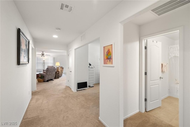 3924 E Garfield Dr, Pahrump, NV 89061 - corridor featuring visible vents, light carpet, and baseboards