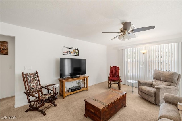 3924 E Garfield Dr, Pahrump, NV 89061 - living room featuring a ceiling fan and light carpet