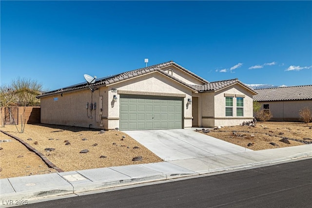 3924 E Garfield Dr, Pahrump, NV 89061 - ranch-style house with stucco siding, driveway, an attached garage, and a tile roof