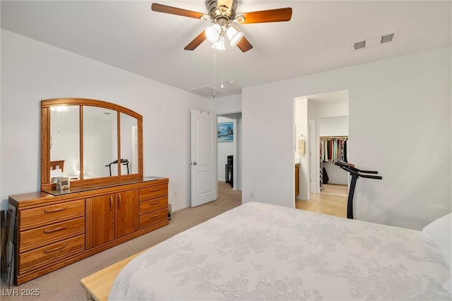 3924 E Garfield Dr, Pahrump, NV 89061 - bedroom featuring visible vents, light carpet, and a ceiling fan