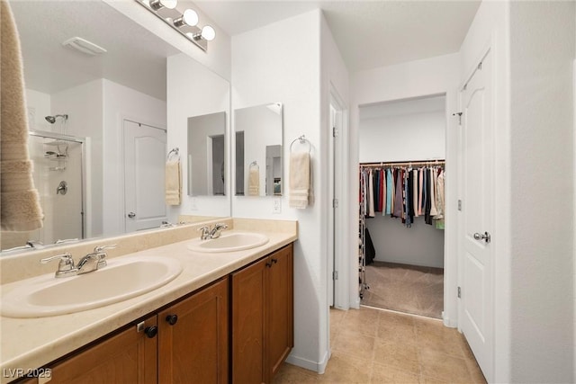 3924 E Garfield Dr, Pahrump, NV 89061 - full bathroom with a shower stall, double vanity, visible vents, and a sink