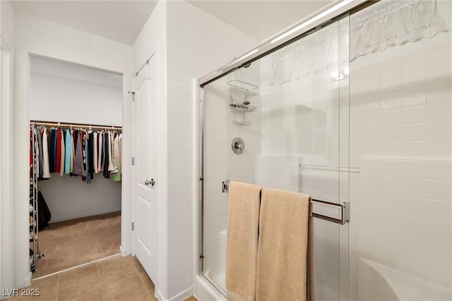 3924 E Garfield Dr, Pahrump, NV 89061 - full bath featuring a walk in closet, tile patterned floors, and a stall shower