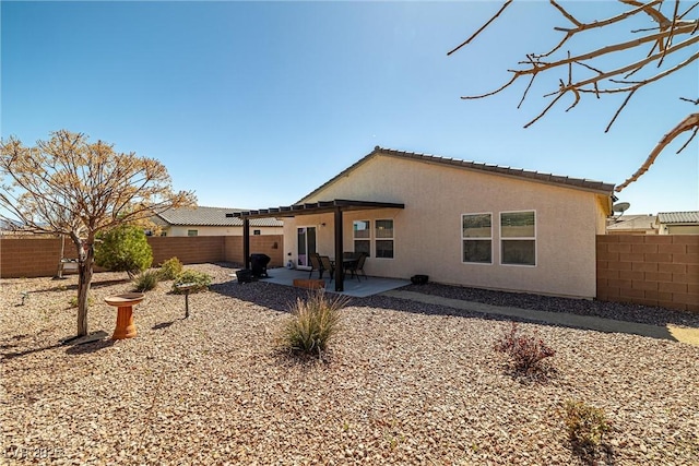 3924 E Garfield Dr, Pahrump, NV 89061 - back of house with a patio area, stucco siding, and a fenced backyard