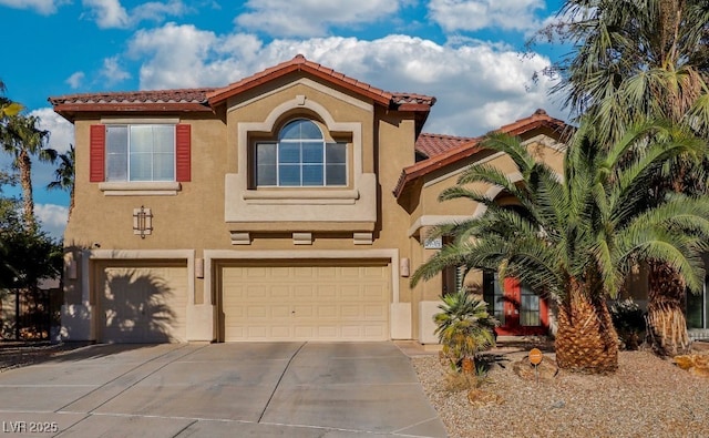 mediterranean / spanish-style house featuring a garage, a tile roof, concrete driveway, and stucco siding