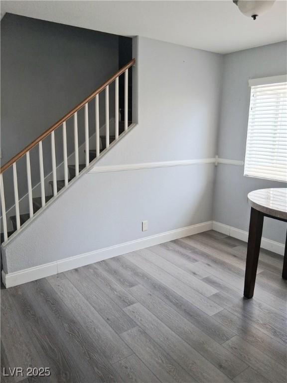 5830 Springmist St, North Las Vegas, NV 89031 - stairway with wood finished floors and baseboards