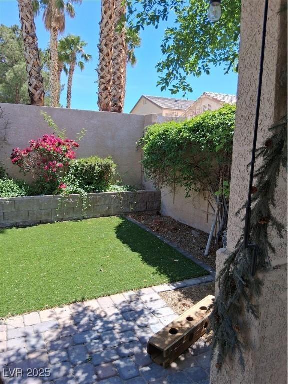 5830 Springmist St, North Las Vegas, NV 89031 - view of yard featuring a patio