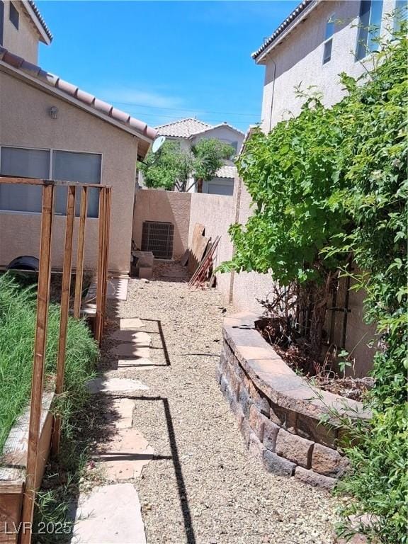 5830 Springmist St, North Las Vegas, NV 89031 - fenced backyard featuring central AC unit